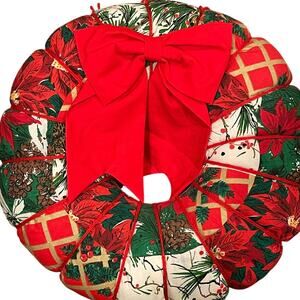 This is a handmade cloth Christmas wreath with a red bow